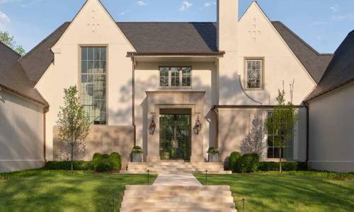 Elegant Limestone Entryway with Copper Lanterns By Castle Homes