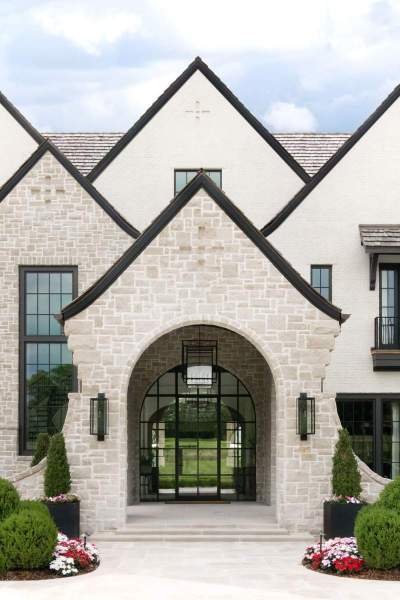 River Song Haven - Stone Facade and Arched Entry – Castle Homes
