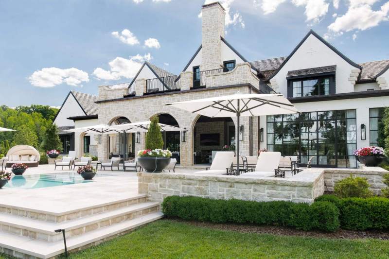 River Song Haven - Poolside Patio and Arched Facade