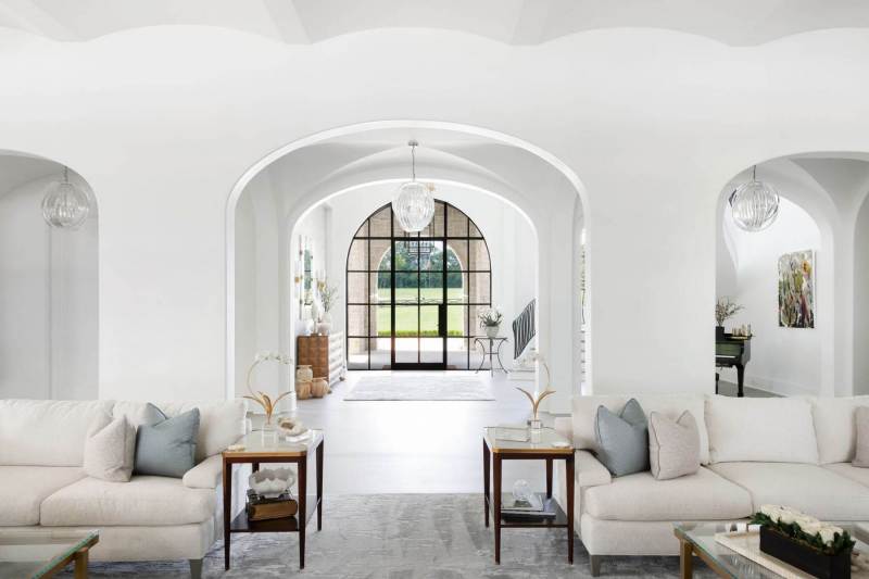 River Song Haven - Arched Hallway and Living Room View – Castle Homes”