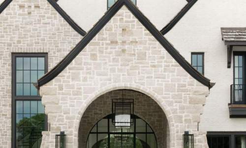 River Song Haven - Stone Facade and Arched Entry – Castle Homes