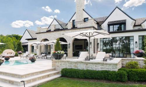 River Song Haven - Poolside Patio and Arched Facade