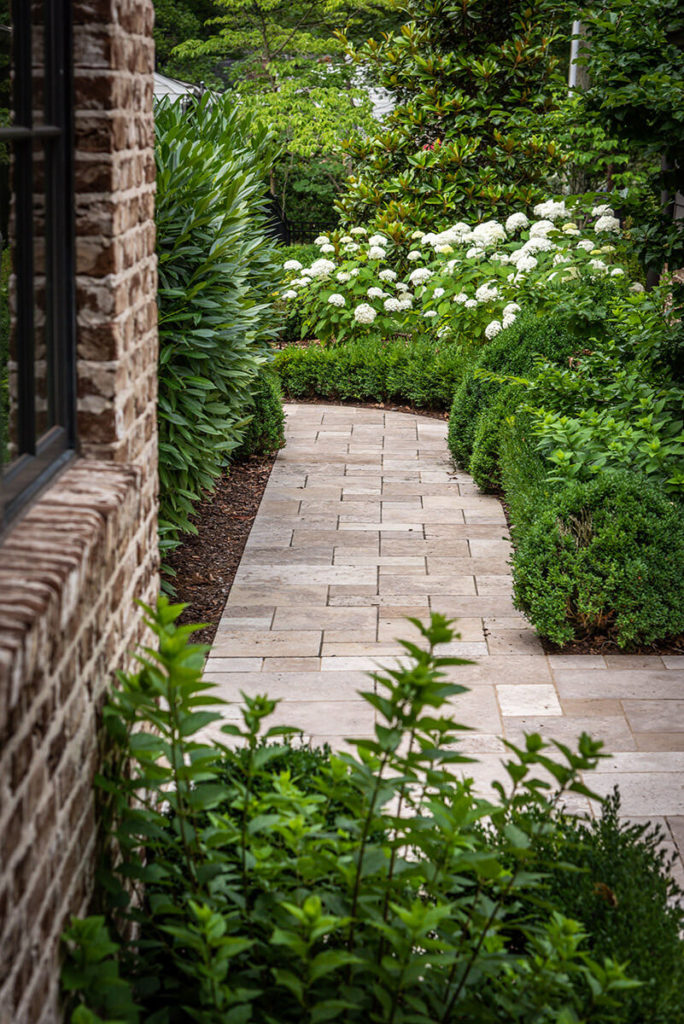 outdoor paver walkway with landscaping