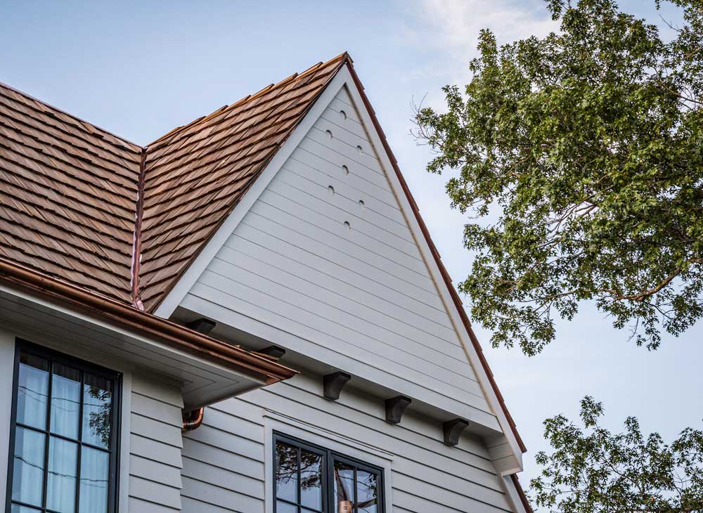 Custom home roof with copper gutters